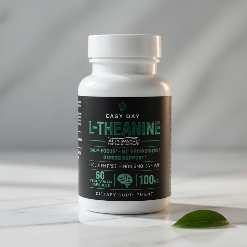 Supplement bottle labeled 'L-Theanine' on a reflective surface with a neutral background